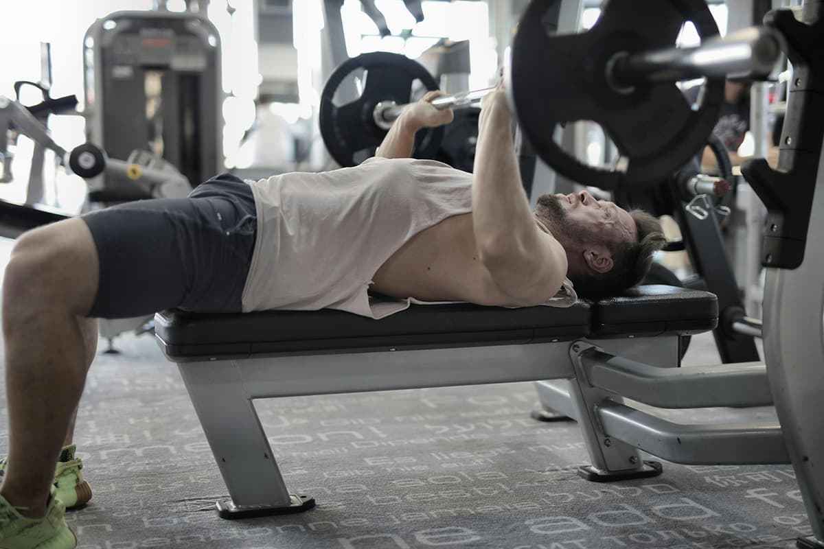 Trainer helping with post-workout recovery